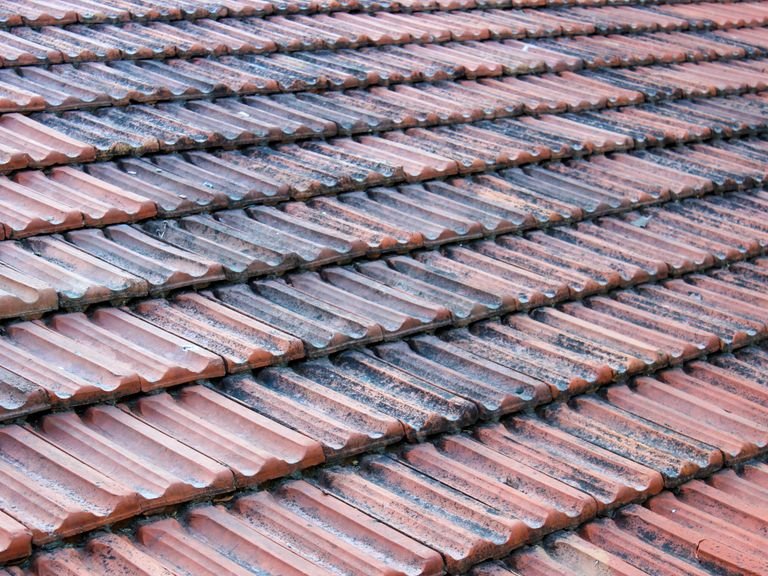Close view of glossy coated roof tiles in rows