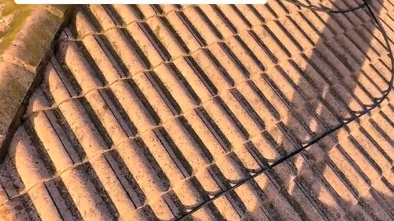 Before: a terracotta tile roof